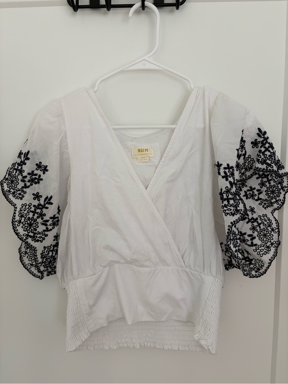 Anthropologie White V-Neck Puff Sleeve Top with Black Floral Embroidery